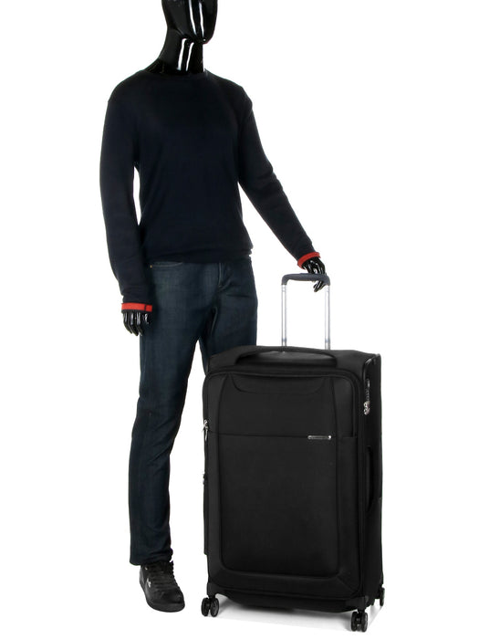 Display of Samsonite D'Lite Large Spinner suitcase with a mannequin in a coat